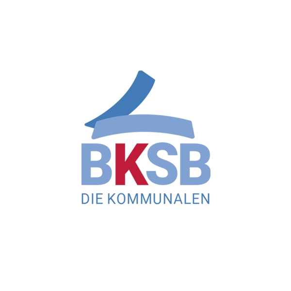 Logo des BKSB – Die Kommunalen, mit stilisierter blauer Dachform und rotem Buchstaben K